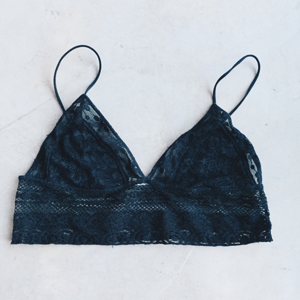 Out from under black lace bralette